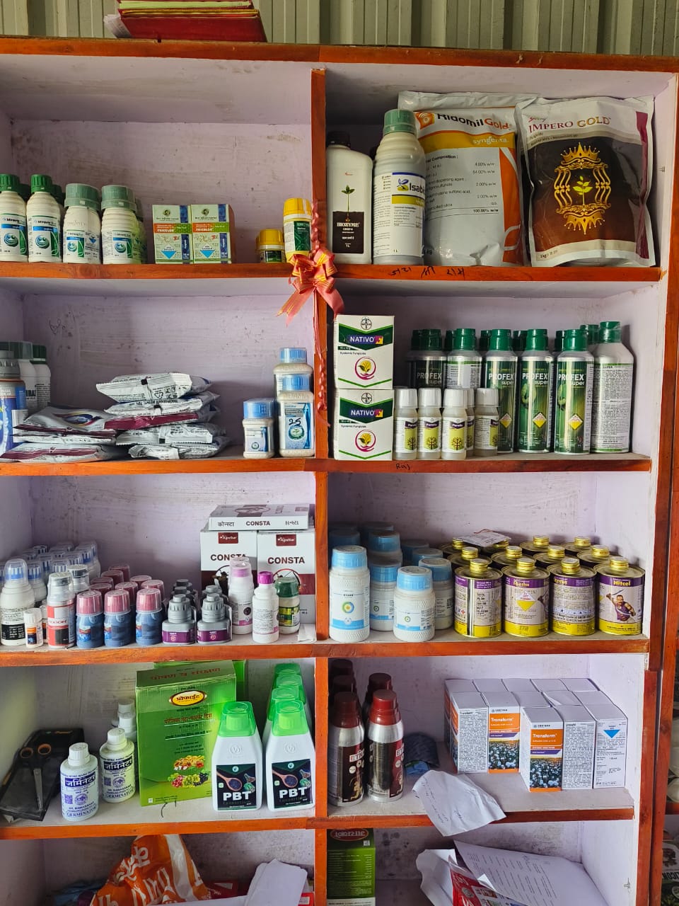Shop shelves stocked with agrochemicals and fertilizers